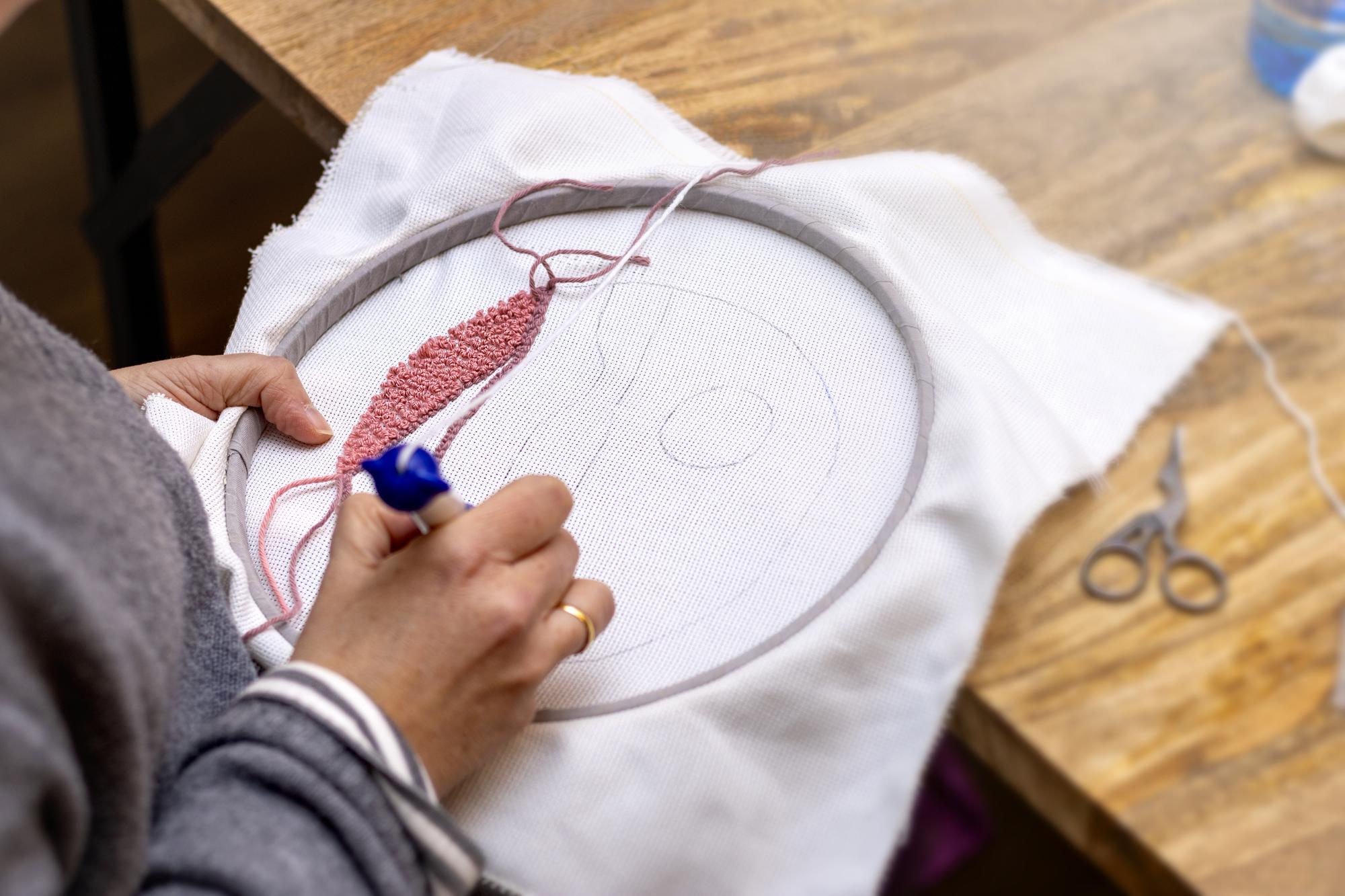 close-up portrait of embroiderer at hoop