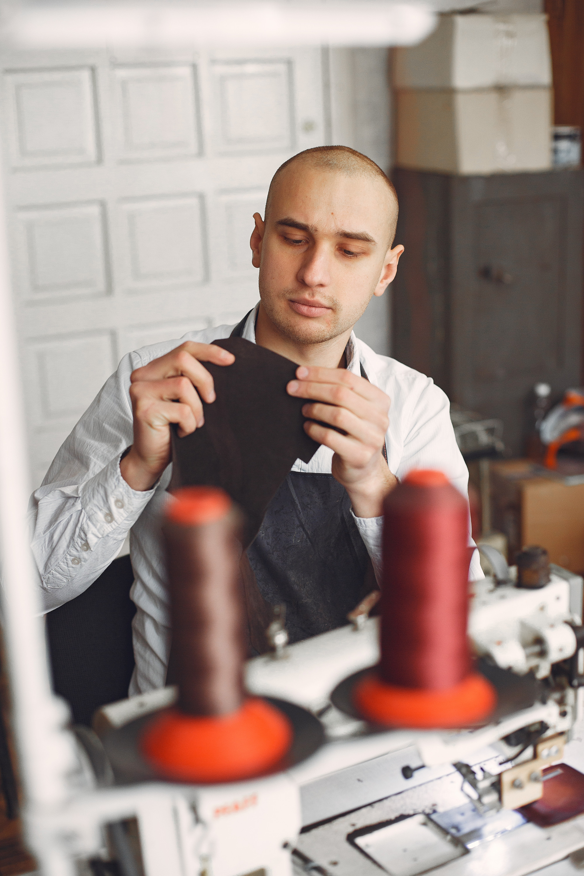 portrait of operations manager with thread spools